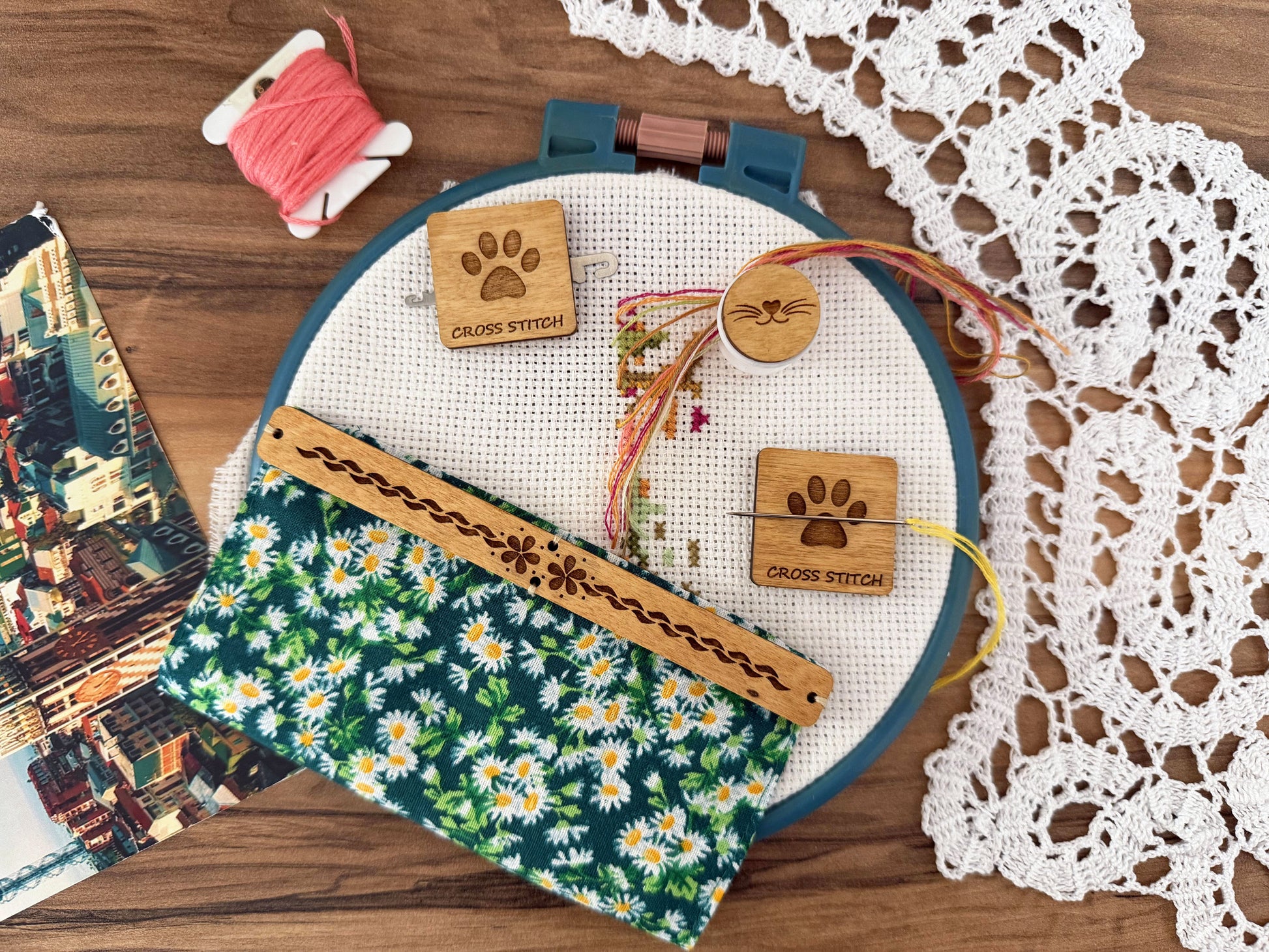 Discover unique cross stitch accessories by Daria Makes, including needle minders, needle threaders, floss organizers, and handmade tools for embroidery and needlework enthusiasts