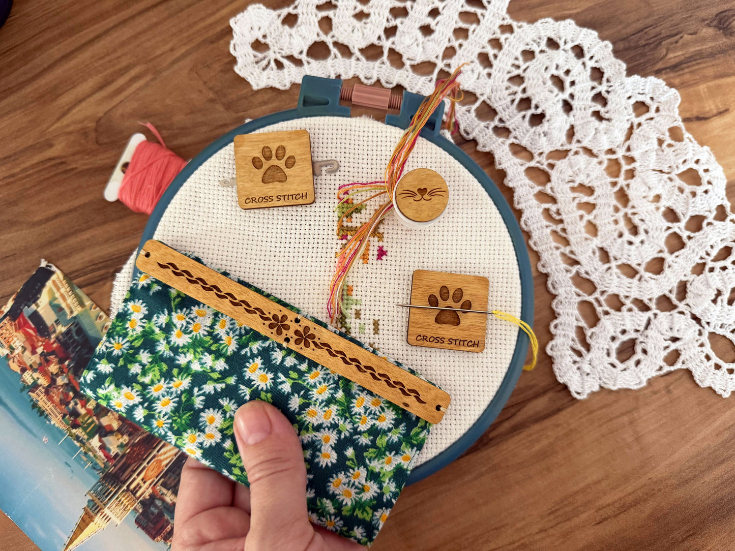 Discover unique cross stitch accessories by Daria Makes, including needle minders, needle threaders, magnetic grime guards, parking bobbins for embroidery and needlework enthusiasts