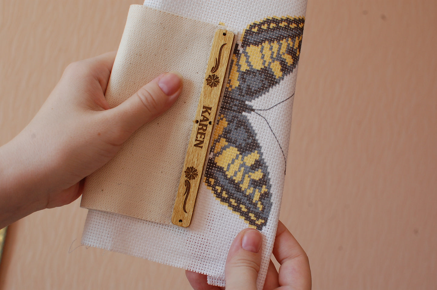 cross stitch stitching in hand