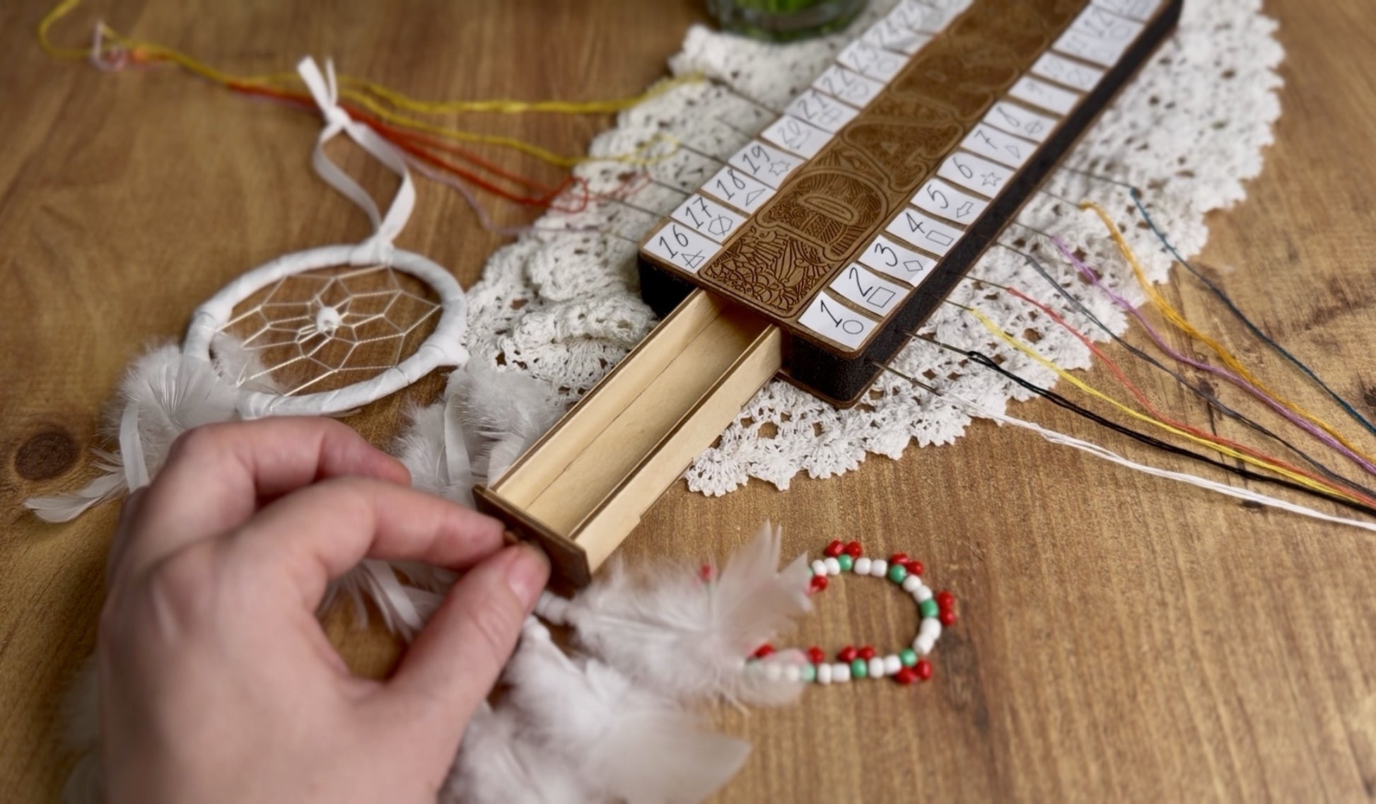 Wooden floss organizer for cross stitch with multiple holes for embroidery threads. This cross stitch floss organizer helps keep embroidery floss neatly separated and easy to access while stitching. A practical embroidery tool for cross stitch projects, needlework, and DIY embroidery kits.

Cross stitch thread organizer made of wood designed to sort embroidery floss by color. Perfect embroidery accessory for cross stitch lovers, helping keep threads tidy during stitching. Ideal for needlework storage, embro
