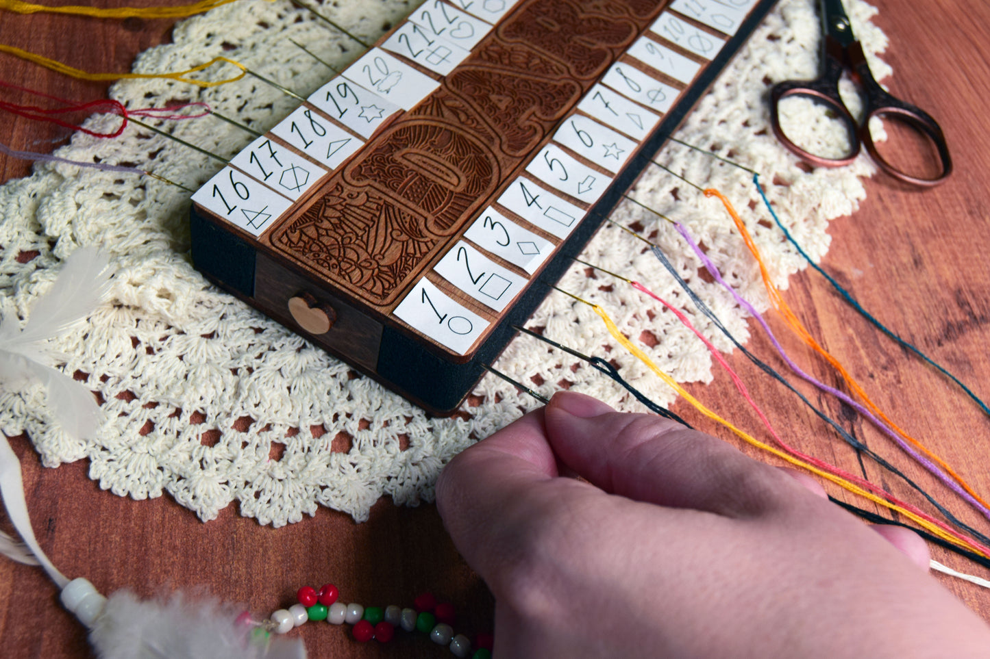 Wooden floss organizer for cross stitch with multiple holes for embroidery threads. This cross stitch floss organizer helps keep embroidery floss neatly separated and easy to access while stitching. A practical embroidery tool for cross stitch projects, needlework, and DIY embroidery kits.

Cross stitch thread organizer made of wood designed to sort embroidery floss by color. Perfect embroidery accessory for cross stitch lovers, helping keep threads tidy during stitching. Ideal for needlework storage, embro