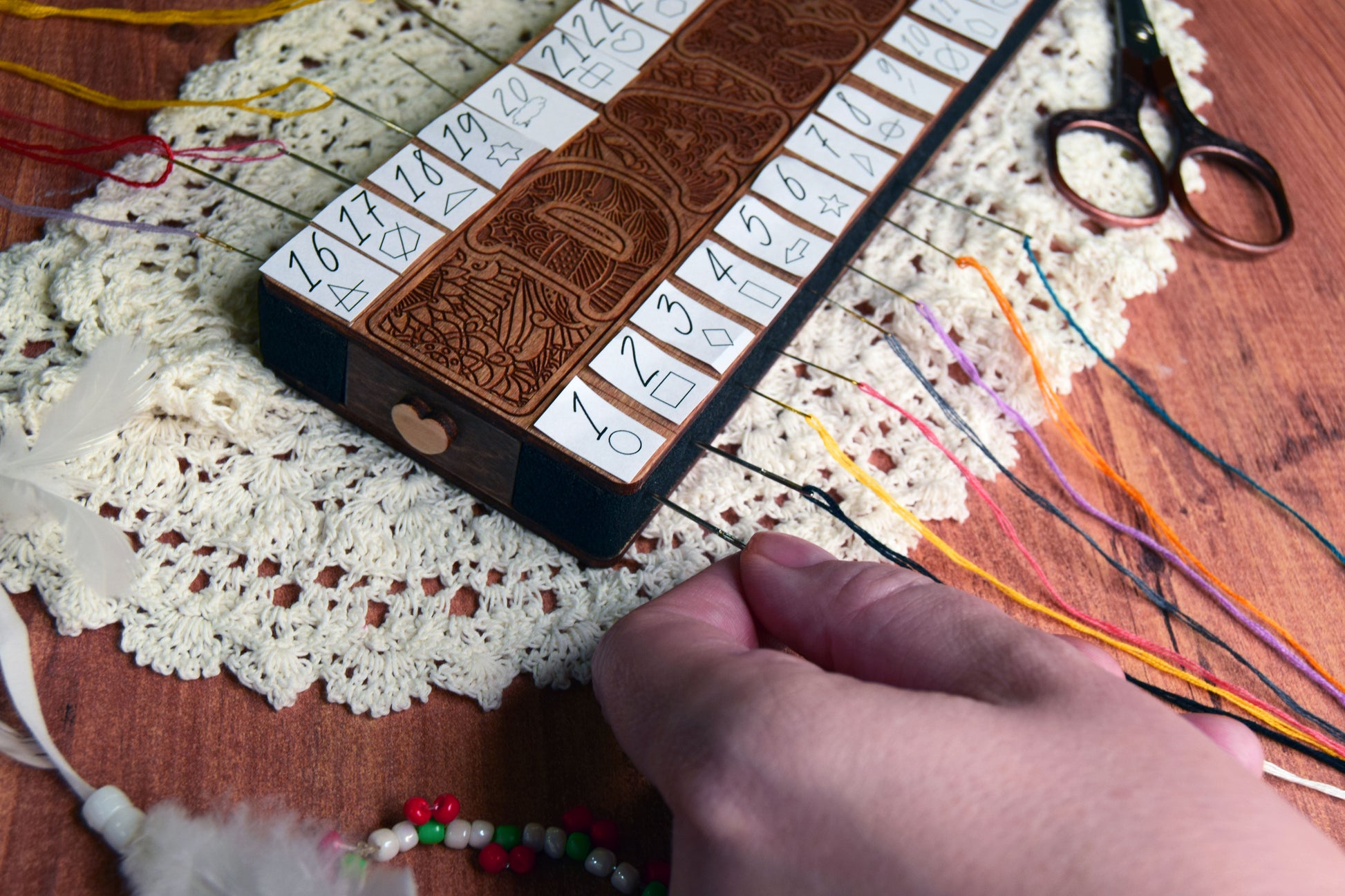 Wooden floss organizer for cross stitch with multiple holes for embroidery threads. This cross stitch floss organizer helps keep embroidery floss neatly separated and easy to access while stitching. A practical embroidery tool for cross stitch projects, needlework, and DIY embroidery kits.

Cross stitch thread organizer made of wood designed to sort embroidery floss by color. Perfect embroidery accessory for cross stitch lovers, helping keep threads tidy during stitching. Ideal for needlework storage, embro